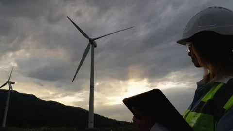 Wind Energy Assessment A professional engineer using a tablet to analyze and Video stock 340923352