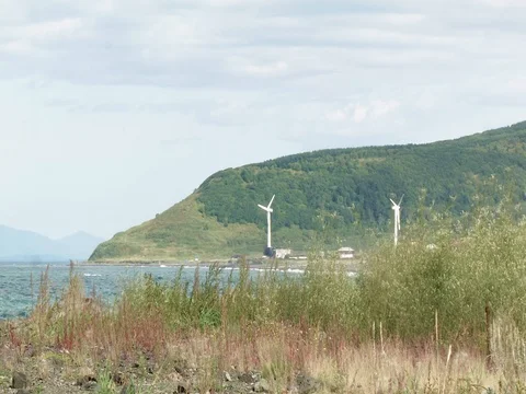 Wind energy on the coast in the afternoon Stock Footage