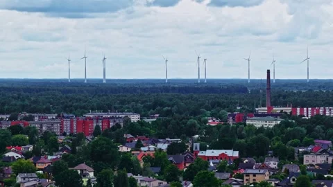 Wind Energy Infrastructure Over a Residential Landscape Stock Footage 337748566