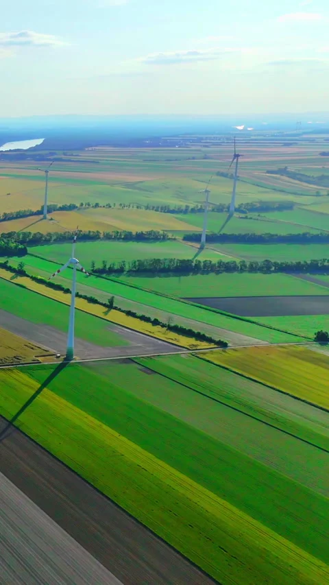 Wind energy park in patchwork fields, Austria Vertical video. Stock Footage 342928822