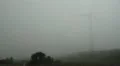 Wind energy turbine in a cloud 20110425 170051 HD Footage