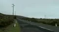 Wind energy turbines near mountain road 20110425 172314 HD Footage