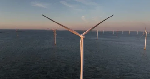 Wind energy from wind turbines on open water, Renewable energy. sunset golden Видео 315756060