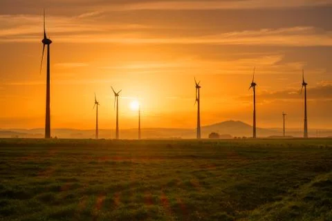 Wind engines at sunset Stock Photos