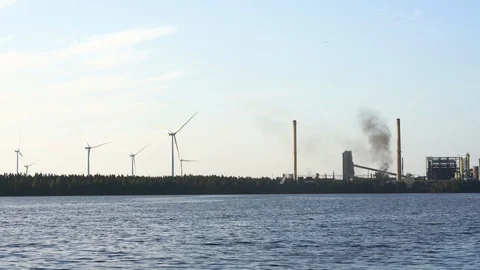 Wind farm with active oil refinery and black smoke 스톡 동영상 117356924