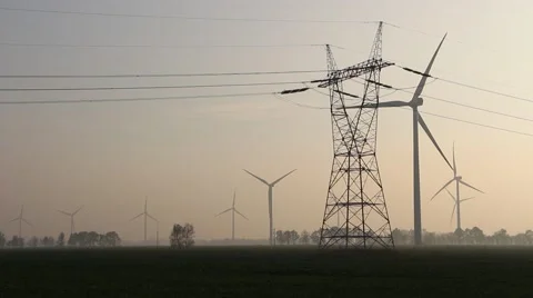 Wind farm and power lines at dusk Video stock 43235342