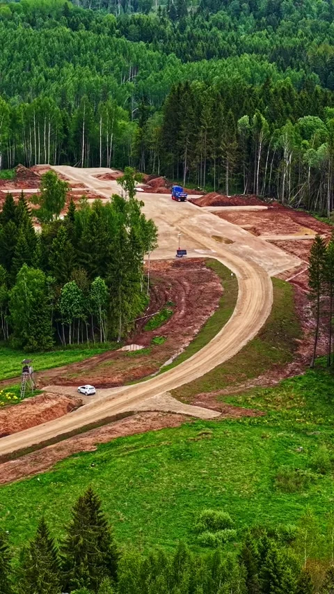 Wind Farm Construction Site and Road Forest Infrastructure Aerial Vertical Stock Footage 336417584