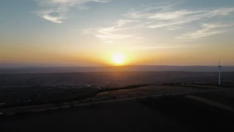 Wind farm on the crest of a hill at sunset. Stock Footage 295149135