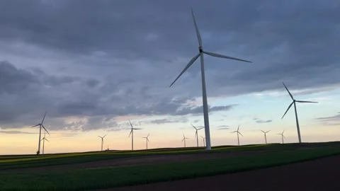 Wind Farm at Dusk Across Rolling Agricultural Landscape Stockbeeldmateriaal 335809117