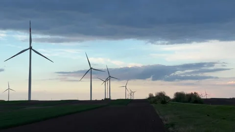 Wind Farm at Dusk Across Rolling Agricultural Landscape Stock Footage 335809275