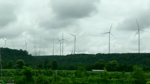 Wind farm electric power generator on cloudy day 24hr clean energy 4k Stock Footage 294876467