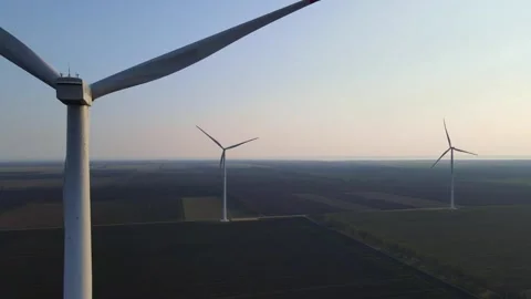 Wind-farm in the evening, sustainable energy, renewable energy concept, rural Stock Footage