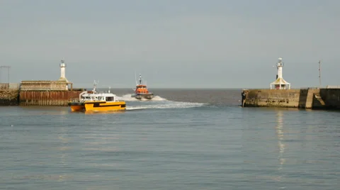 Wind farm Fast Support Vessels returning to harbour, Lowestoft, Suffolk, England Stock Footage 38313683