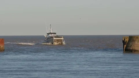 Wind Farm Fast Support Vessels returning to harbour, Lowestoft, Suffolk, England Stock Footage 80271013