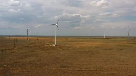 Wind farm in the field, cloudy weather Stock Footage 202102319