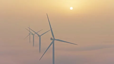 Wind farm generating clean, green, and renewable electricity. Eolic generators Stock Footage 332093351