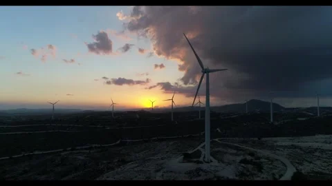 Wind farm with high wind turbines on cloudy afternoon. Stock Footage 260501170