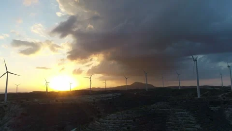 Wind farm with high wind turbines on cloudy afternoon. Stock Footage 260501172