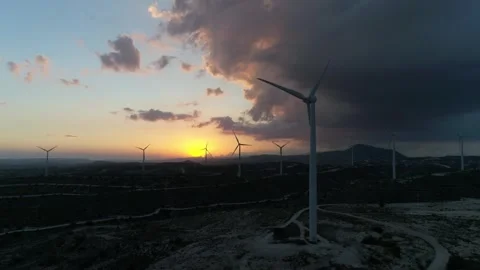 Wind farm with high wind turbines on cloudy afternoon. Stock Footage 260501202