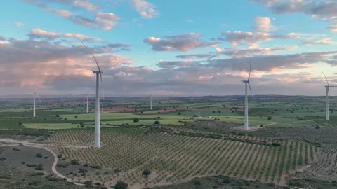 Wind farm in operation at the end of the day with a cloudy sky Stock Footage 274528283