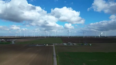 Wind Farm Over Agricultural Fields Under Dramatic Clouds – Germany 4K Drone Stock Footage 341850686