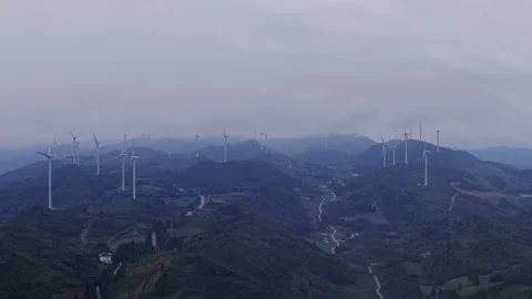 Wind Farm on Rolling Hills Mountain Push In at Twilight 4K HLG Stock Footage 345621670