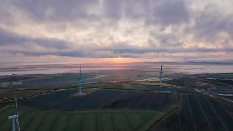 Wind farm with several wind generators in the middle of agricultural farms Stock Photos