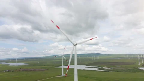 Wind farm with spinning windmill generator located on the windy landscape Video stock 156034580