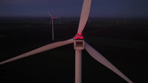 Wind farm at sunrise or sunset. Aerial night view of Windpark with wind turbines Stock Footage 327279748