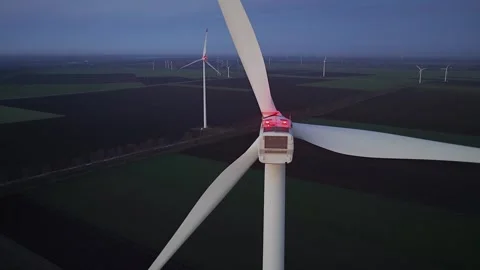Wind farm at sunrise or sunset. Aerial night view of Windpark with wind turbines Stock Footage 331026330