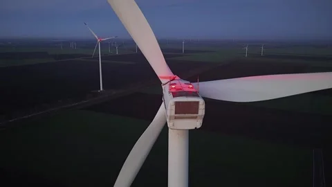 Wind farm at sunrise or sunset. Aerial night view of Windpark with wind turbines Stock Footage 331198330