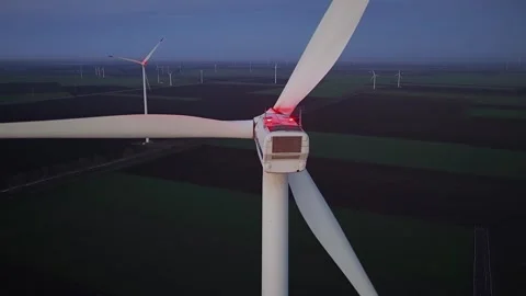 Wind farm at sunrise or sunset. Aerial night view of Windpark with wind turbines Stock Footage 332244459