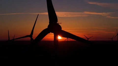 Wind farm at sunrise, wind generators aerial view, windmills generating Stock-Footage 308481697