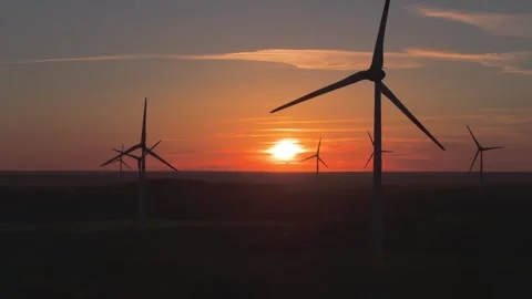 Wind farm at sunrise, wind generators aerial view, windmills generating Stock-Footage 308482031