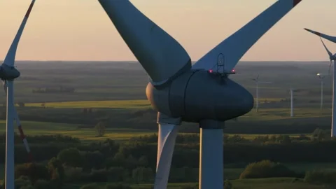 Wind farm at sunrise, wind generators aerial view, windmills generating Stock-Footage 308482050