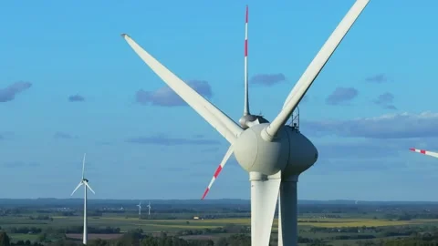 Wind farm at sunrise, wind generators aerial view, windmills generating Stock-Footage 308482078