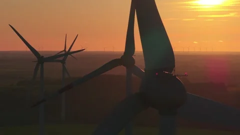 Wind farm at sunrise, wind generators aerial view, windmills generating Stock Footage 308482082