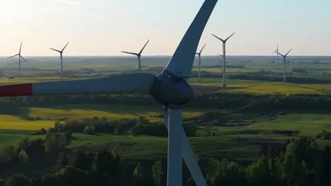 Wind farm at sunrise, wind generators aerial view, windmills generating Stock Footage 308482096