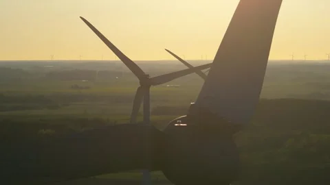 Wind farm at sunrise, wind generators aerial view, windmills generating Stock Footage 308482101