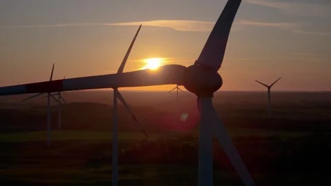 Wind farm at sunrise, wind generators aerial view, windmills generating Stock Footage 308482117