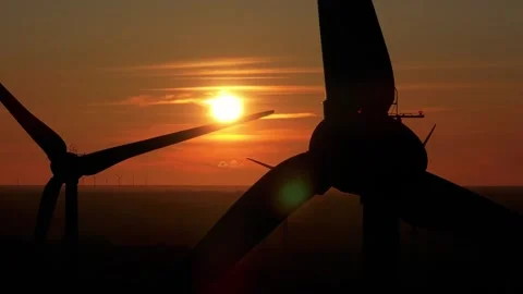 Wind farm at sunrise, wind generators aerial view, windmills generating Stock Footage 308482123