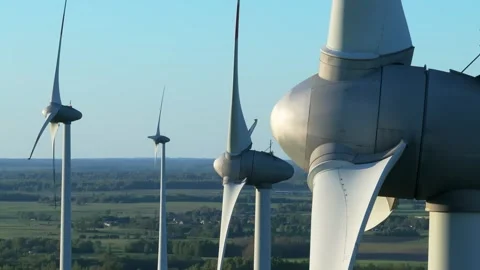 Wind farm at sunrise, wind generators aerial view, windmills generating Stock Footage 308482127