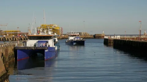 Wind Farm Support Vessels gathering in Lowestoft Harbour, Suffolk, England Stock Footage 80271251