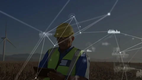 Wind farm technician tapping tablet, starting network linking nodes with Stock Footage 334178933