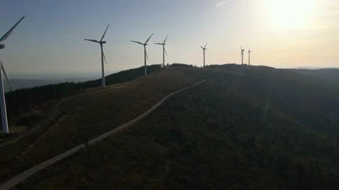 Wind farm on top of the mountain during sunset Stock Footage 171884487