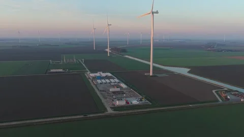 Wind farm turbines generating power with battery storage system Stock-Footage 332680703