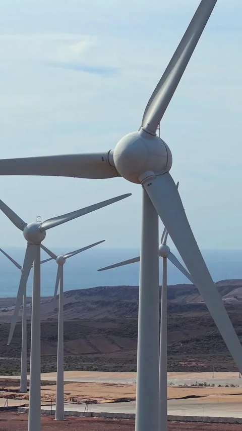 Wind farm turbines with rotating blades producing sustainable and clean Video stock 328695348