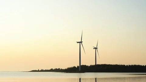 Wind farm, view of two wind turbines spinning in the wind at sunset Stock-Footage 117349053