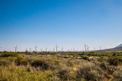 Wind farm with wind powered power generating turbines Stock Photos