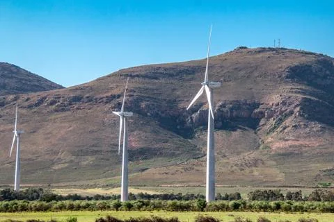 Wind farm with wind powered power generating turbines Stock Photos